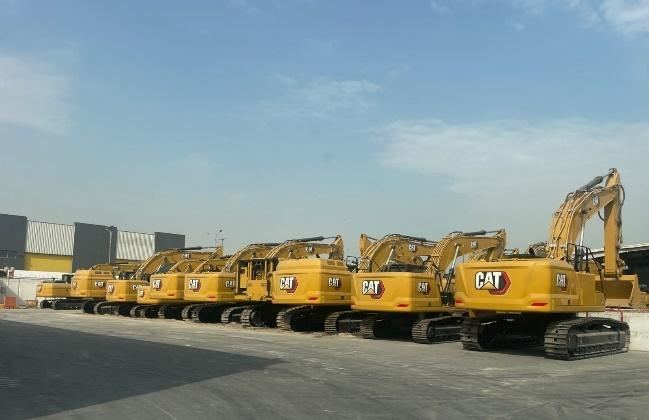 Paver and dump truck laying asphalt